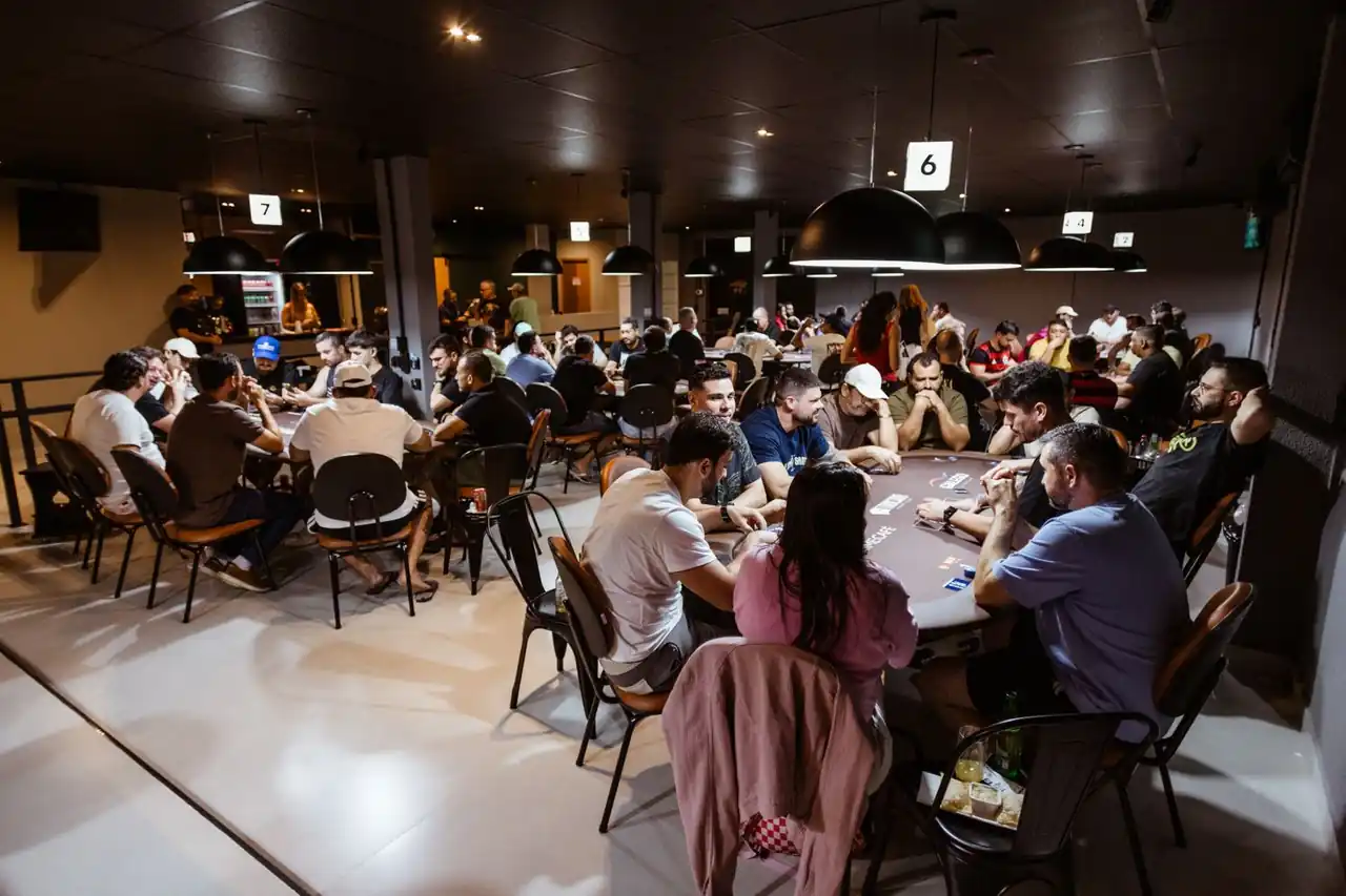 Sophisticated social tournament atmosphere with focused participants