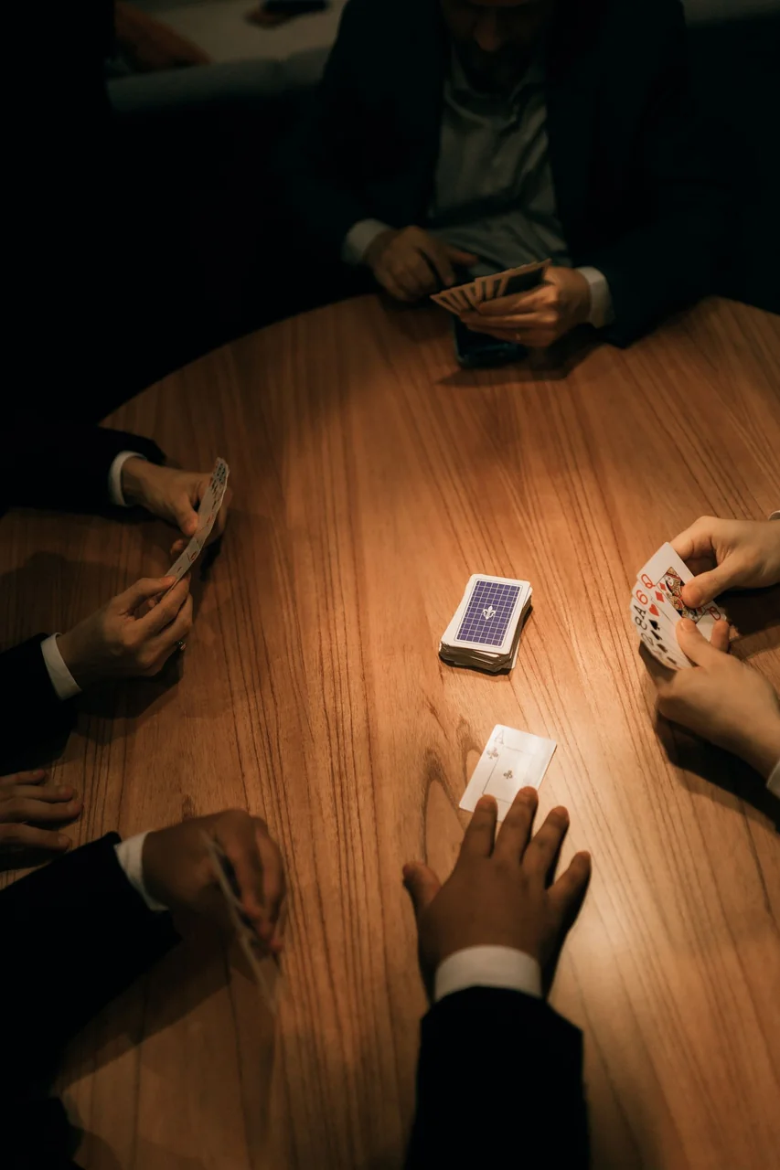Tournament gathering in a moody bar setting